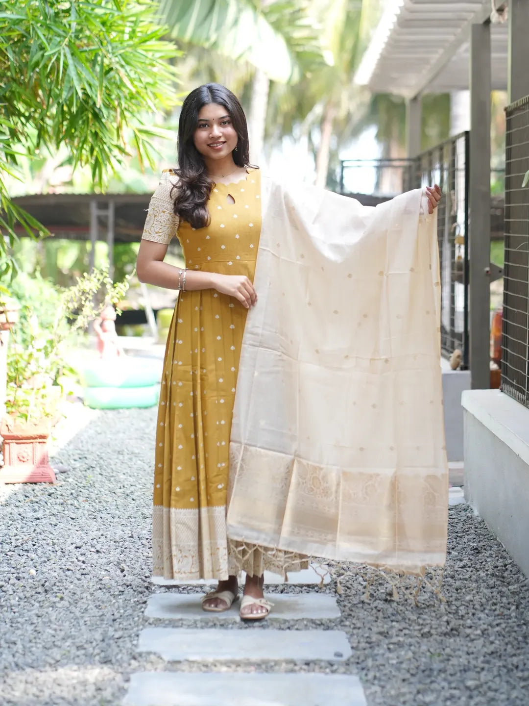 Mustard ethnic with a ivory soft zari weaved dupatta